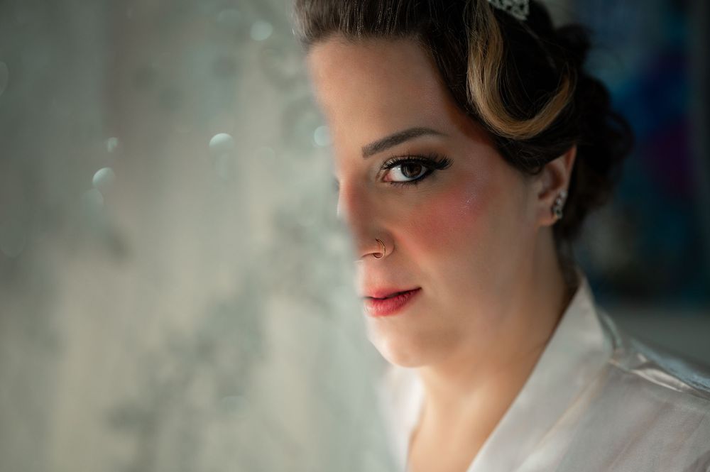 The bride looks beyond her wedding dress.