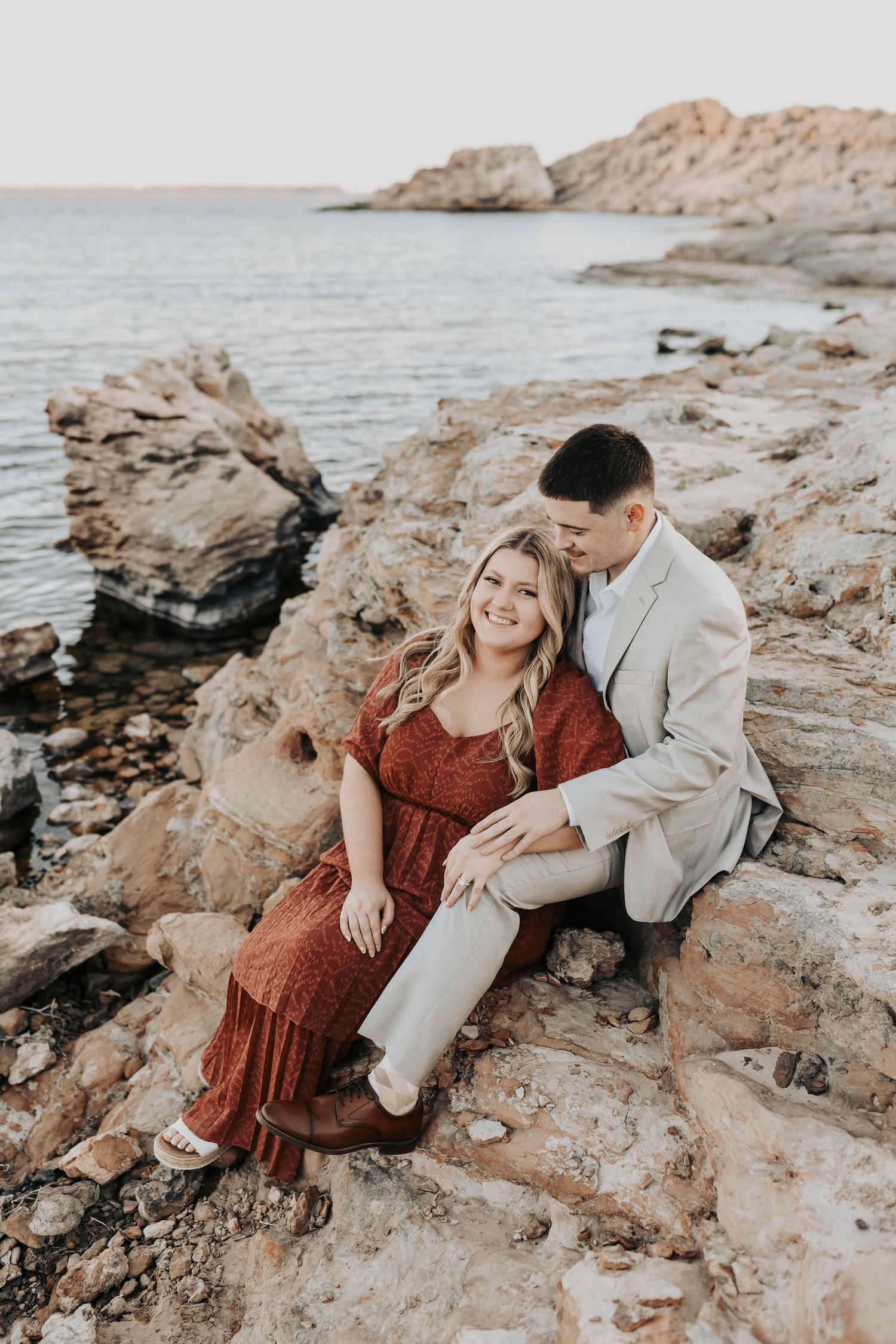 Couple walking toward sunset during engagement session at Murrell Park.