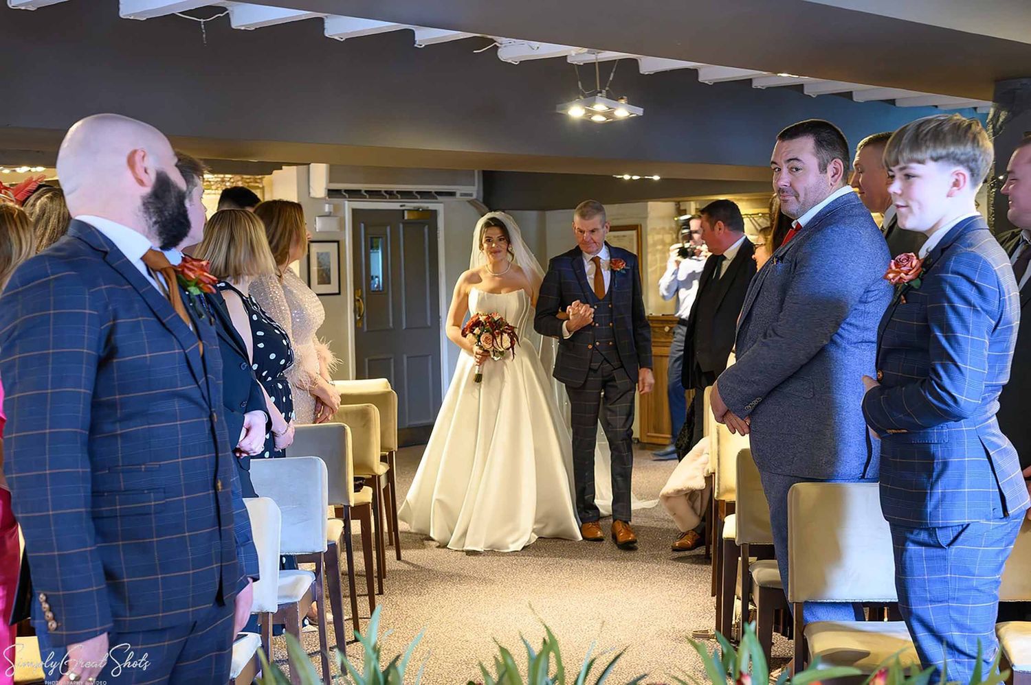 Father of the bride walking Stacey down the aisle at the civil ceremony in the Warwick Suite, The Saxon Mill, Warwick — wedding photography