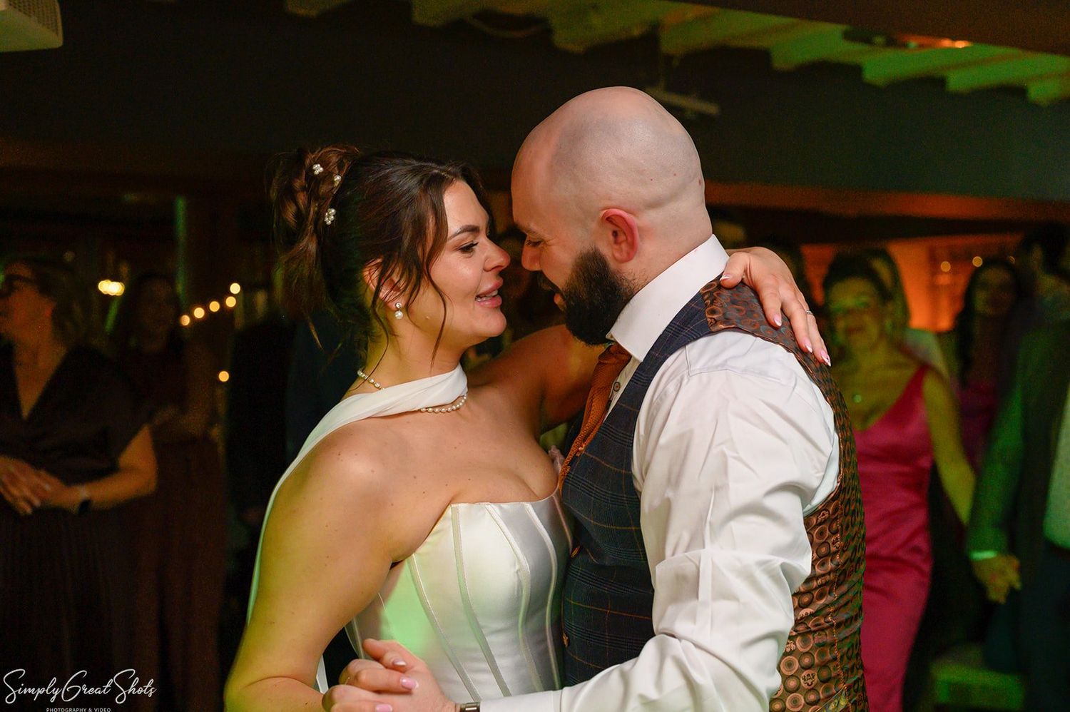Bride Stacey and groom Jack sharing their first dance at The Saxon Mill, Warwickshire. Wedding photography by SimplyGreatShots