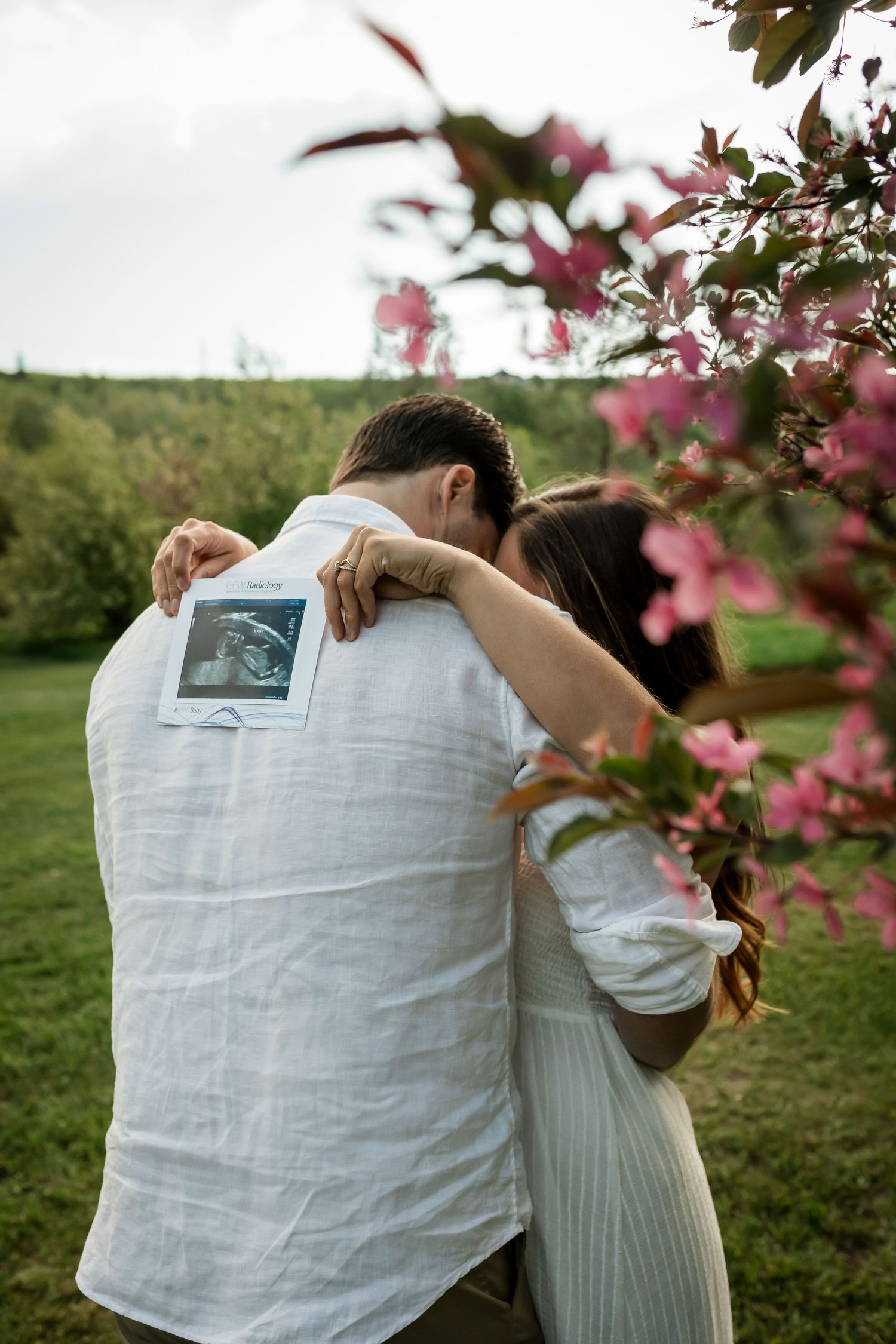 Beautiful spring golden hour photos in the cherry blossom flowers by Calgary lifestyle photographer, Love & Sunshine Photography.