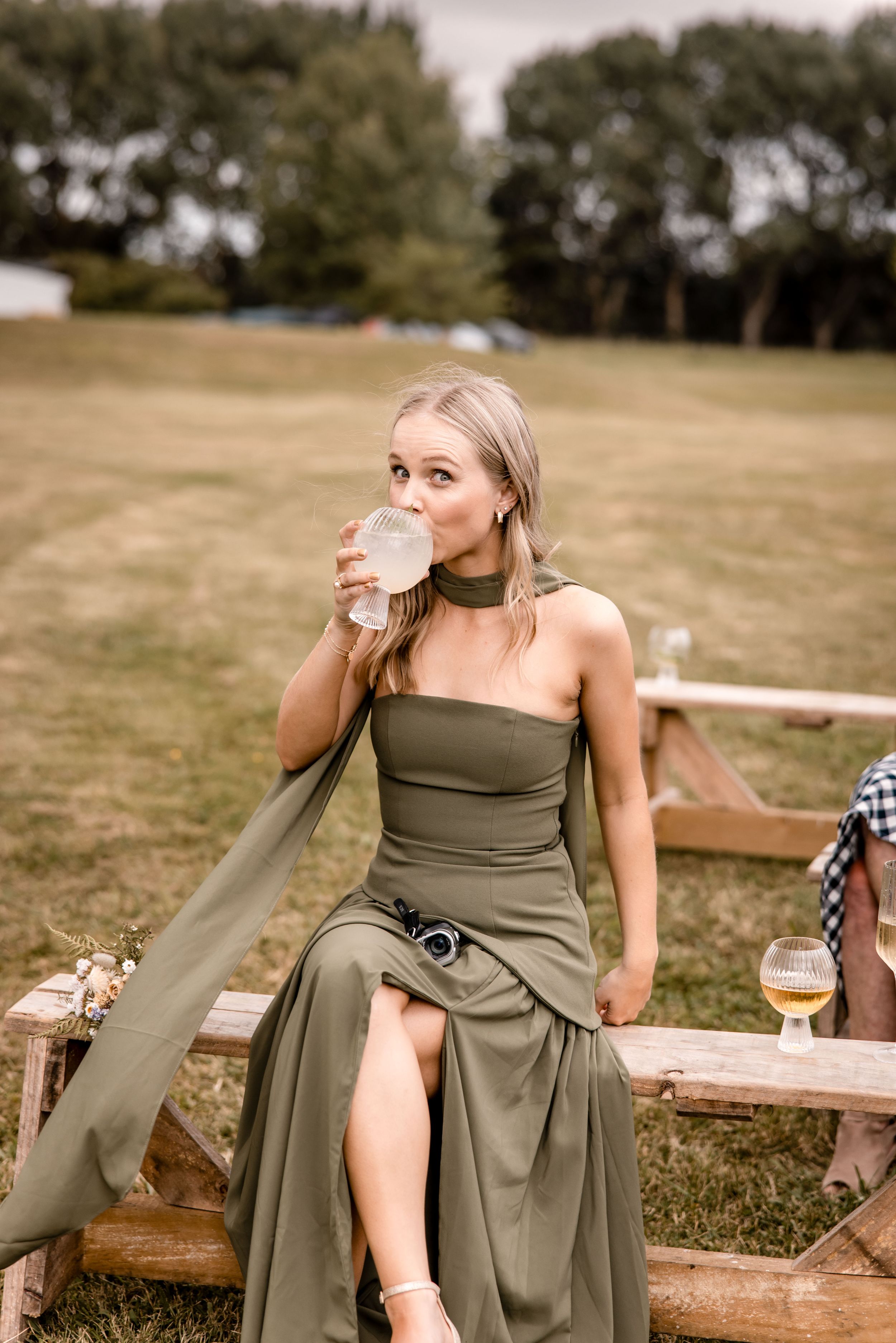 Wedding guest having a gin