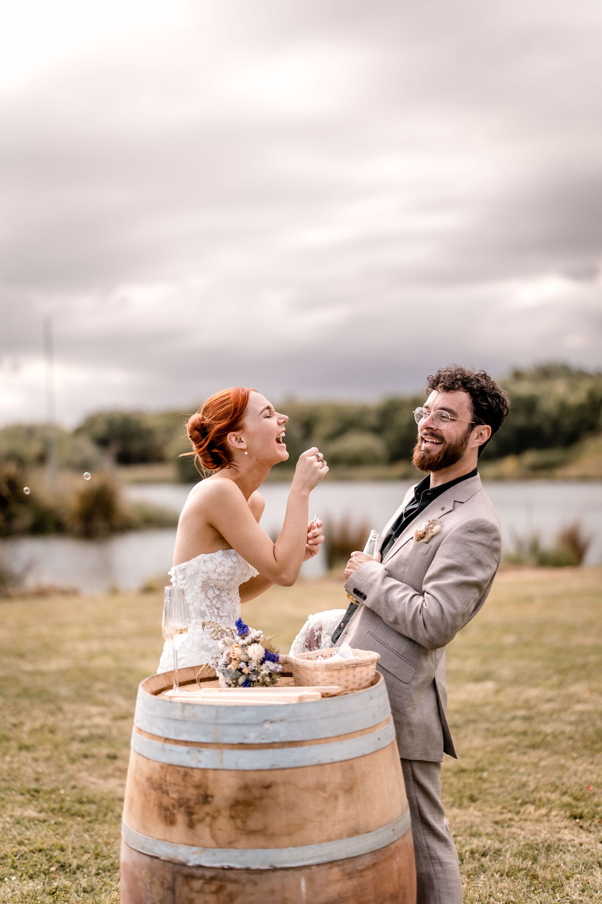 Bride and Groom blowing bubbles at Back Paddock Lakes Hawkes Bay