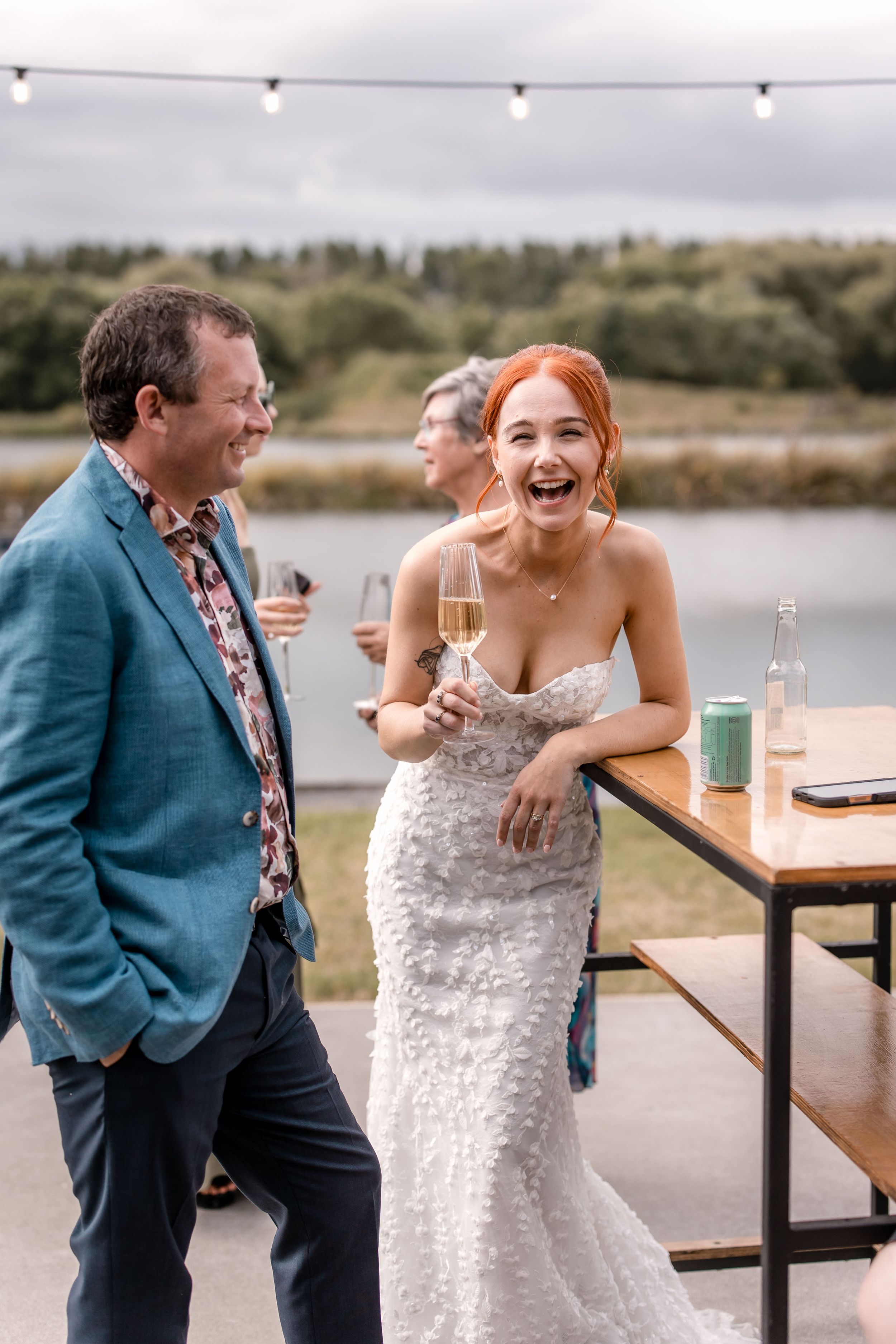 Bride talking and laughing with guest