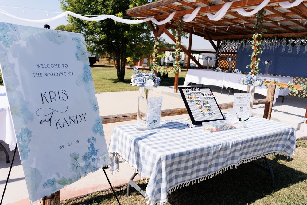 White tablecloths with a guest sign in book for  a Montana wedding.
