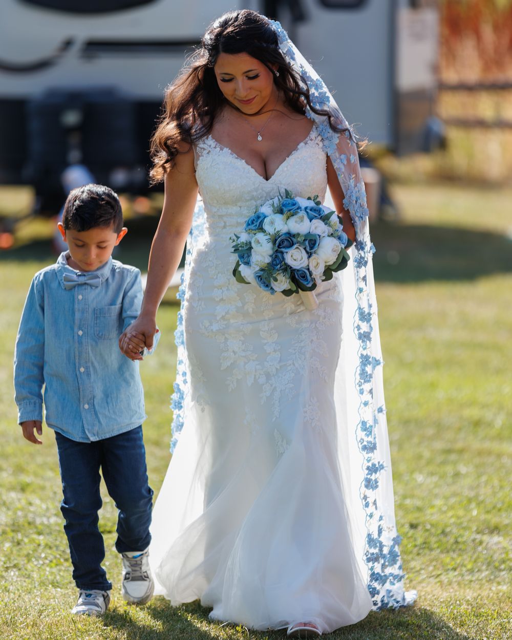 son of bride walks his mom "Montana bride" down the isle