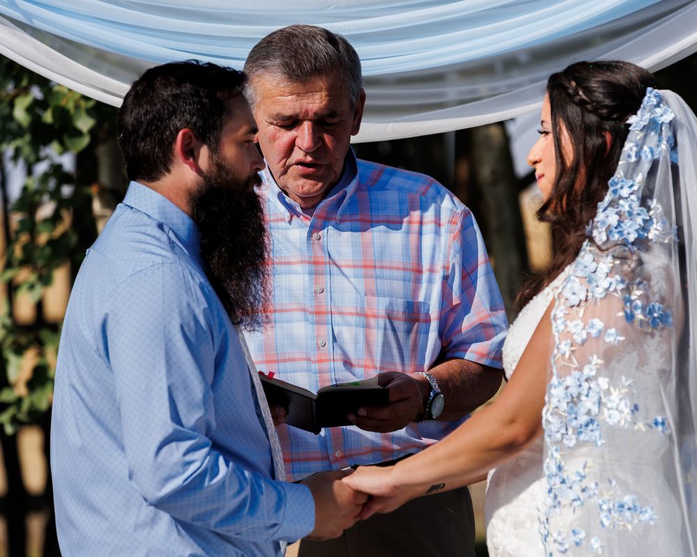 Bride and groom share a moment just before exchanging rings