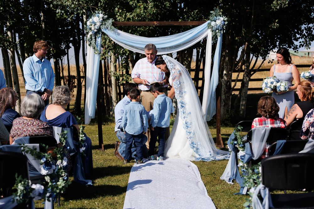 Groom gives brides sons a gift before the bride and groom say i do