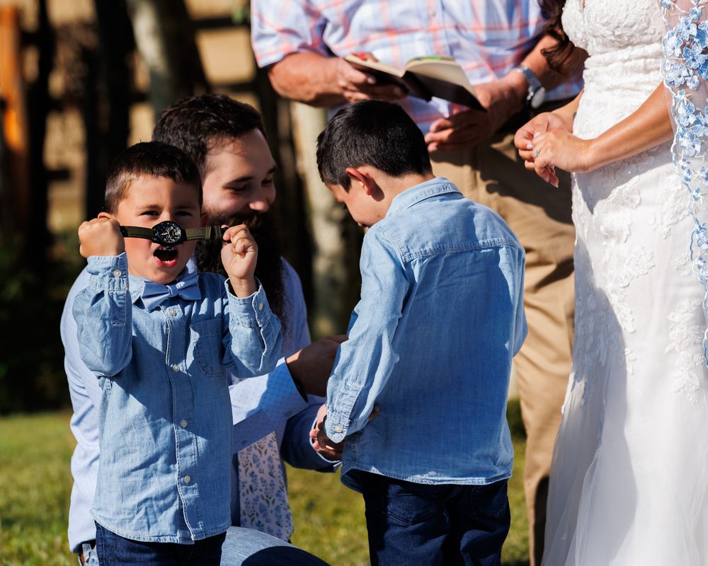 Son of bride celebrates a gift from the groom. Montana documentary wedding photographer
