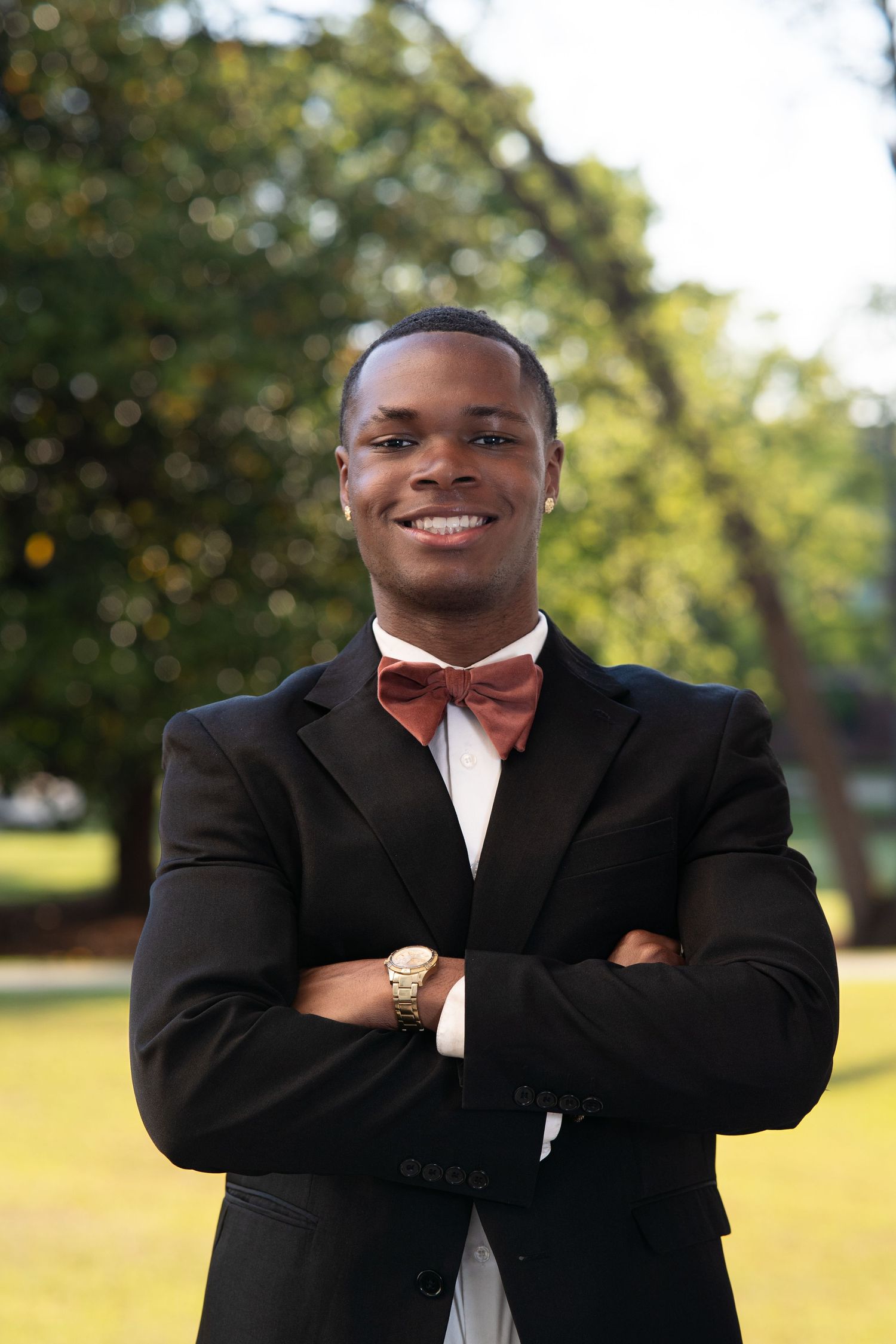 Professional portrait series showing a person in a black blazer outdoors with natural lighting and blurred background.