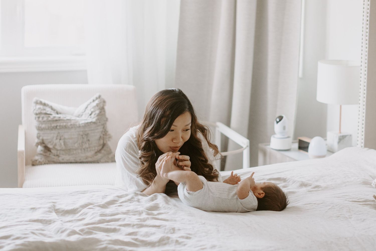 A cozy home photography session for a family with a newborn baby and dogs.
