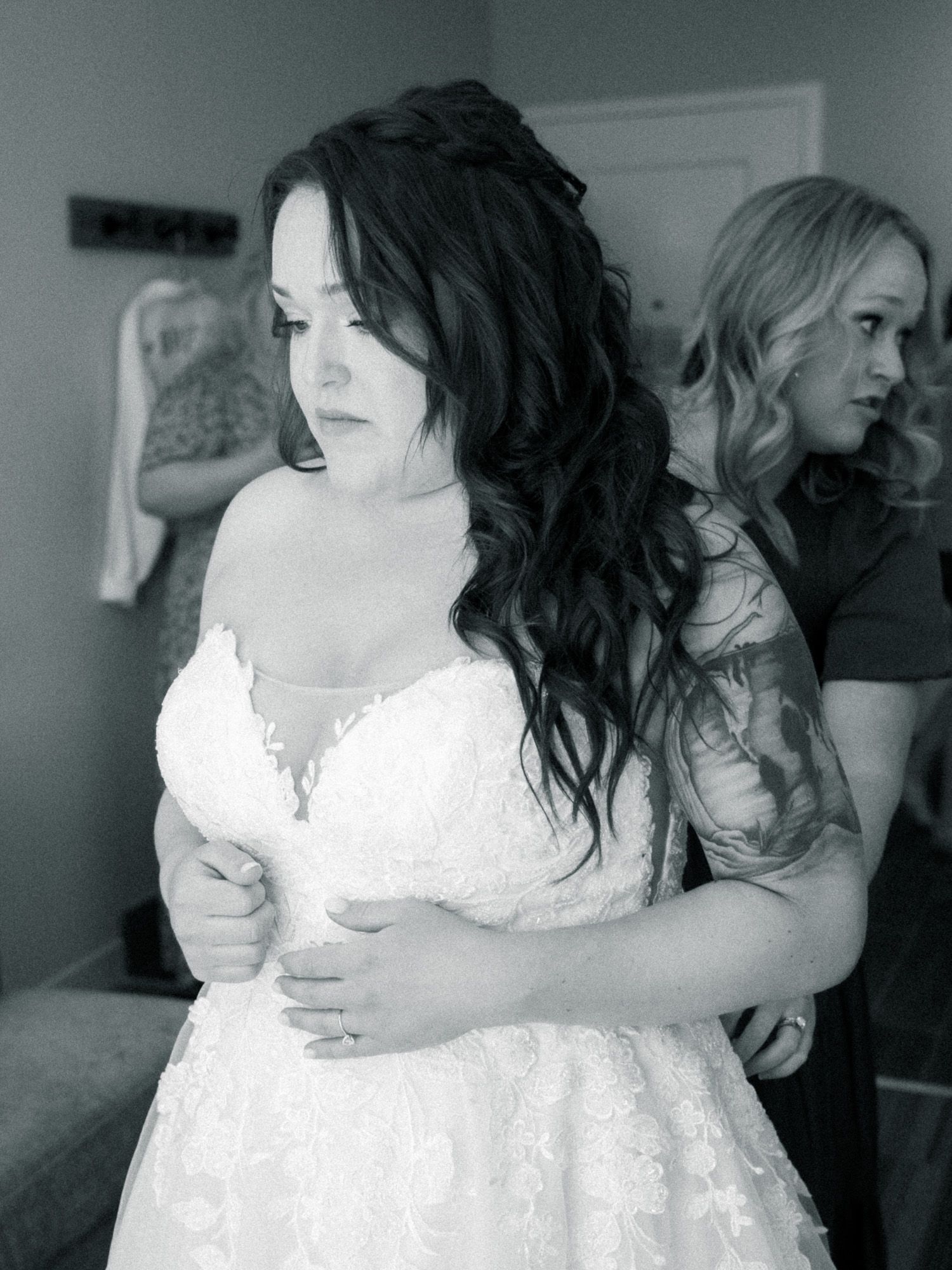A series of black and white photographs showing tender moments between people in formal attire at what appears to be a wedding.