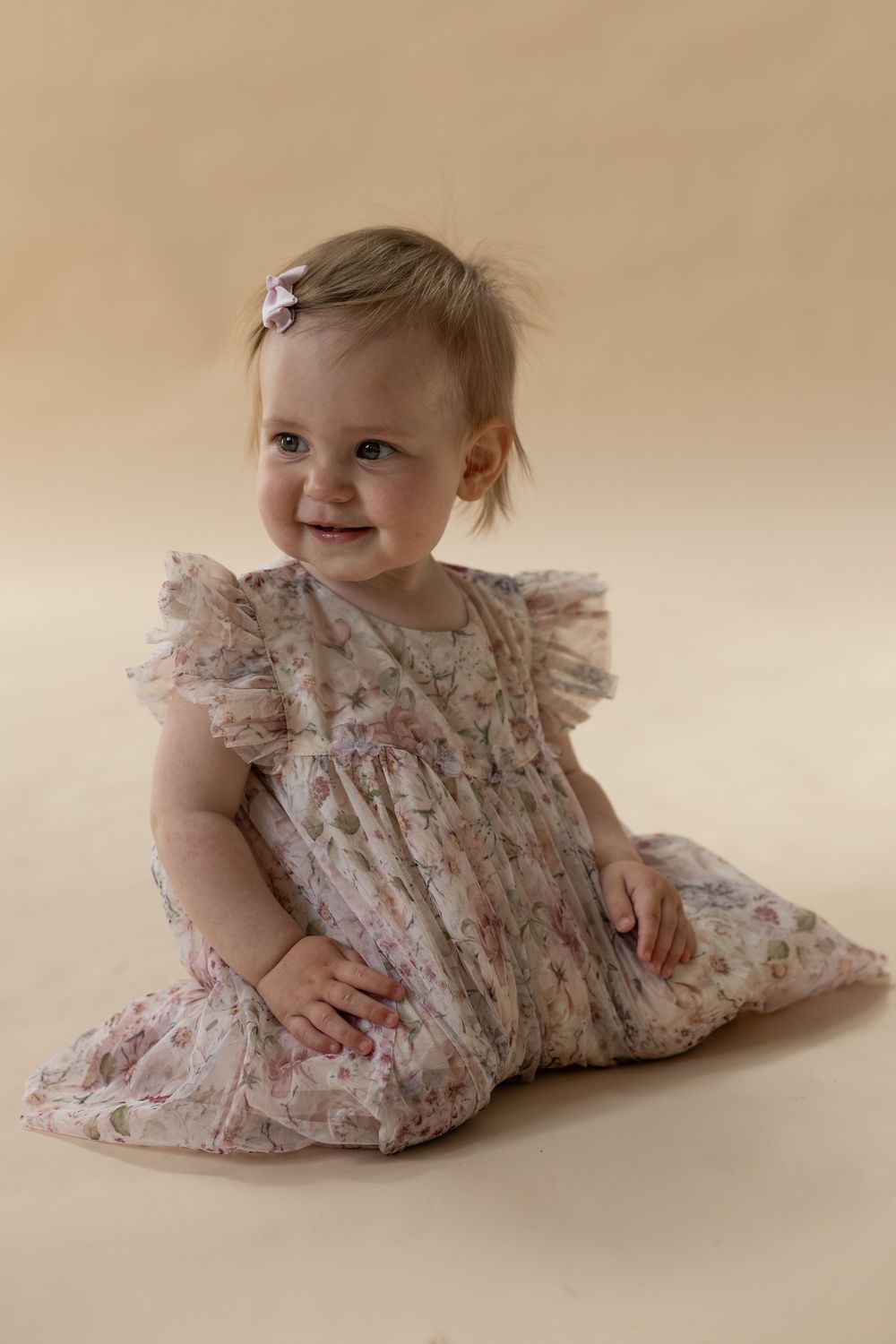 Smiling baby during a 1st birthday Milestone studio session in Bedfordshire.
