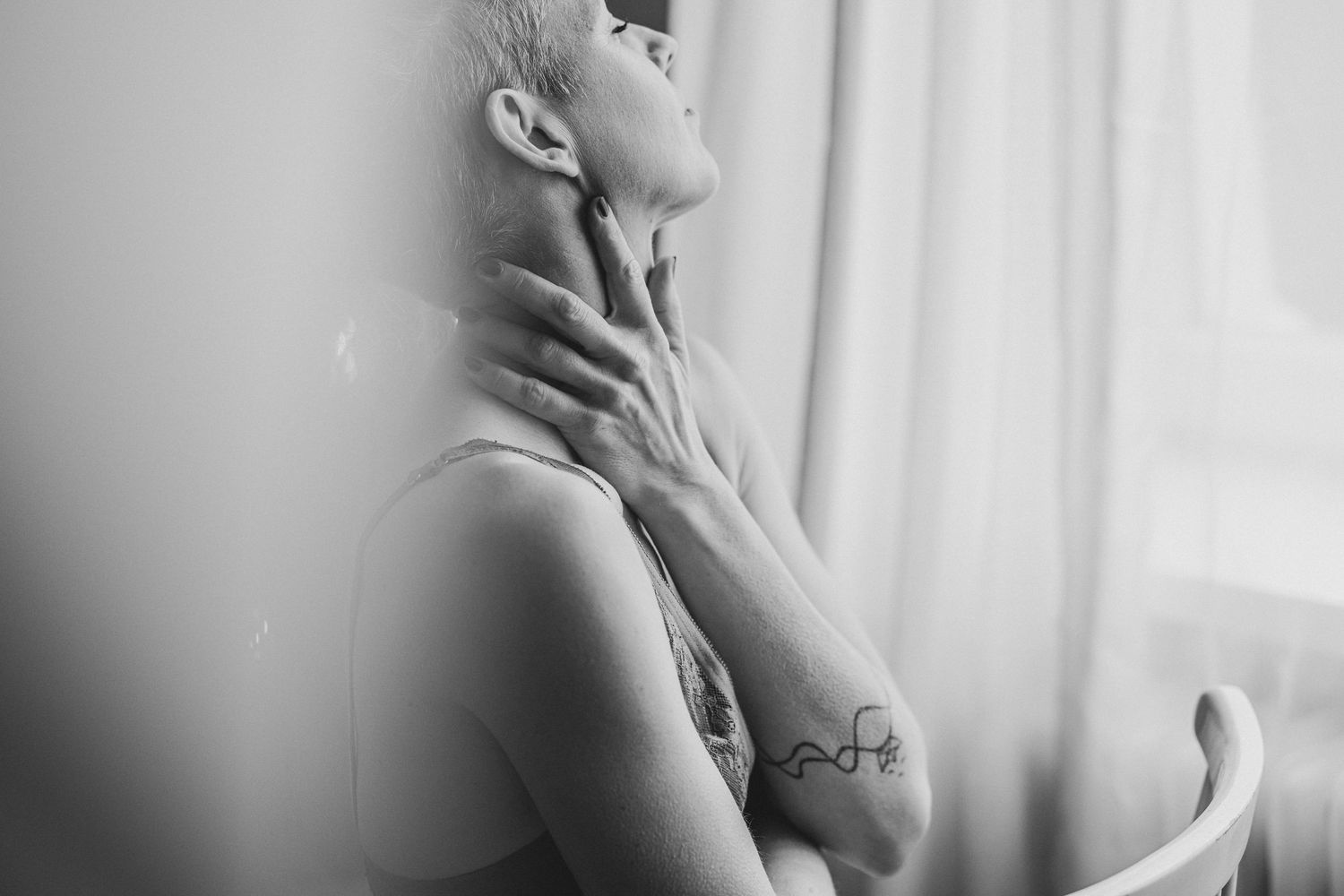 A black and white artistic photo series showing close up profile views of a person against a light background.