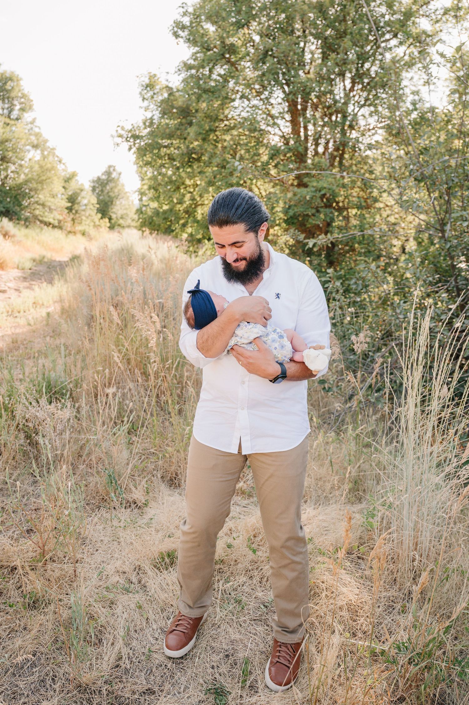 A series of candid outdoor photos showing joyful moments in tall grass and trees during golden hour.