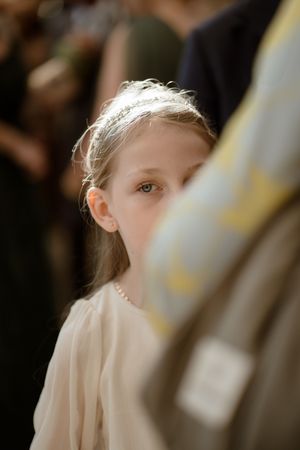 A series of soft focus images show a person in white wearing a veil, captured in a dreamy wedding photography style.