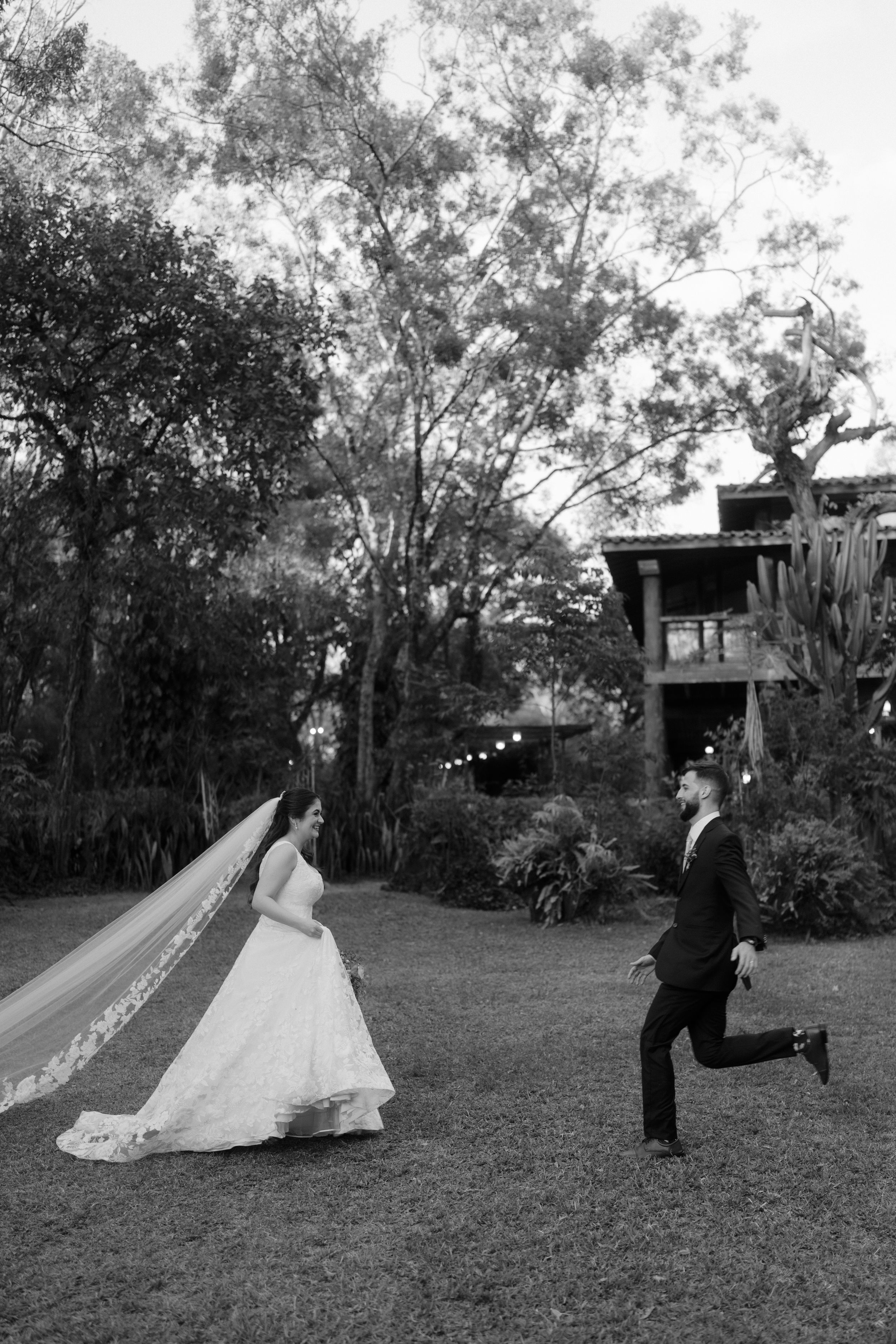 A romantic sequence of black and white wedding photos showing a couple dancing and twirling in a garden setting.