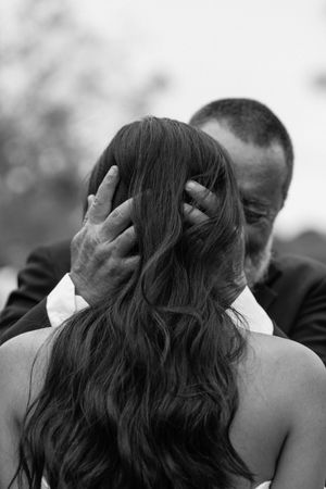A black and white photo sequence shows a couple embracing and kissing during what appears to be a wedding ceremony.