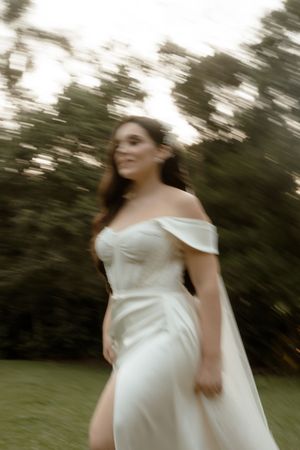A dreamy motion blur sequence shows a person in a flowing white off-shoulder dress against a natural outdoor backdrop.