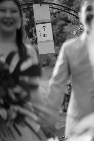 A blurry black and white photo collage shows multiple overlapping images with indistinct figures and shapes.