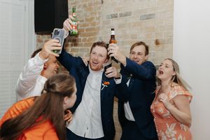 A sequence of four candid photos showing people laughing and enjoying drinks together at a social gathering.