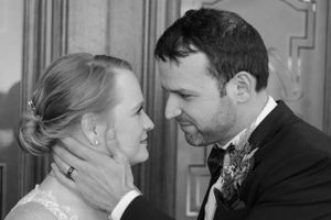 Romantic black and white portrait series of newlyweds sharing tender moments.
