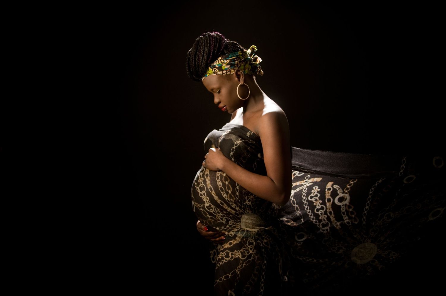 Dramatic silhouette photography with elegant poses against dark background.