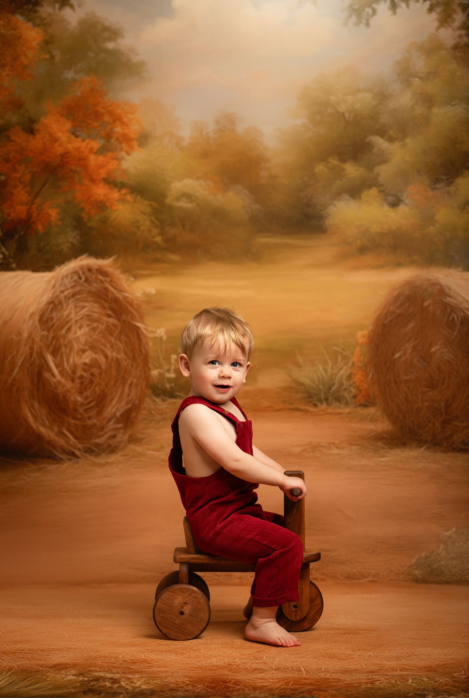 Studio portrait of a figure in a burgundy dress against an autumn-colored background with warm brown and orange tones.