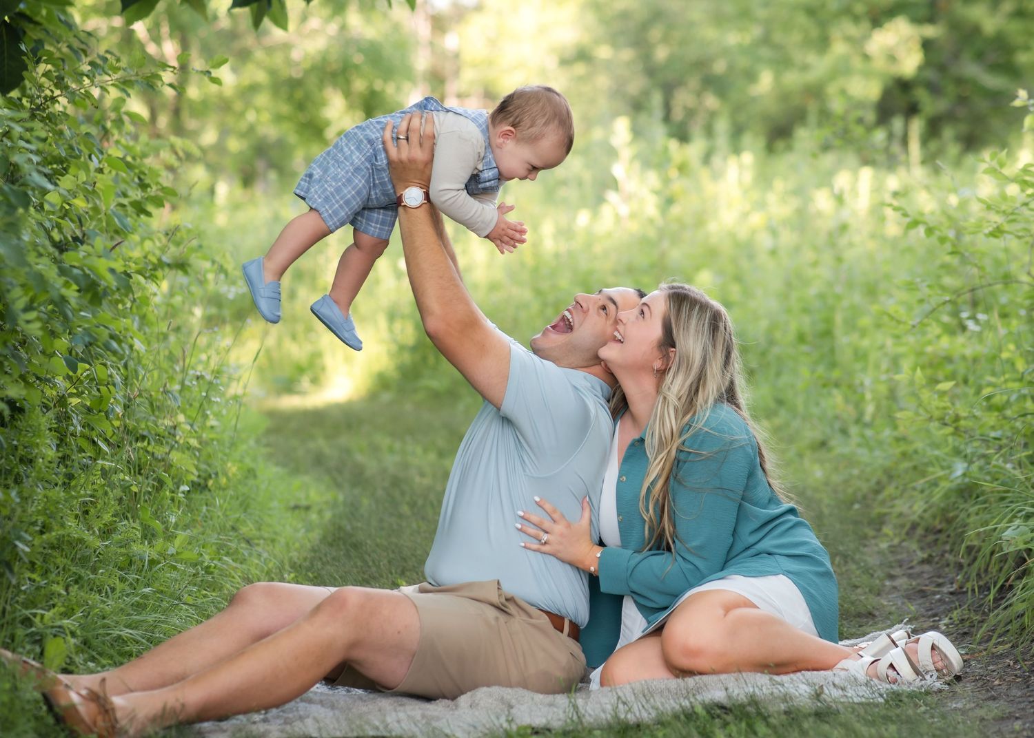 A series of candid outdoor photos showing joyful moments between a parent and baby on a summer day in nature.