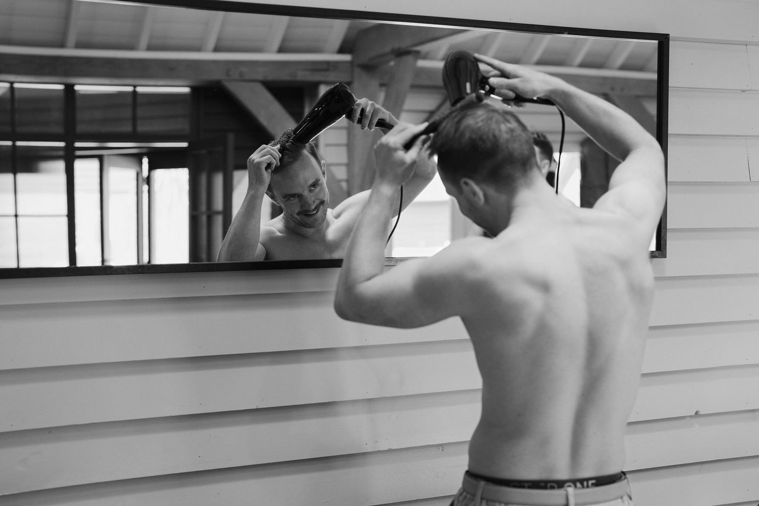 Tunnels Beach Wedding Venue in North Devon, Groom drying hair