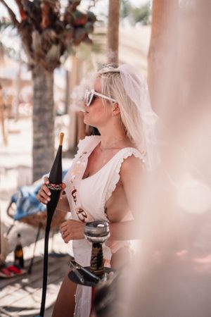 Celebration with champagne bottles in a tropical beach setting.