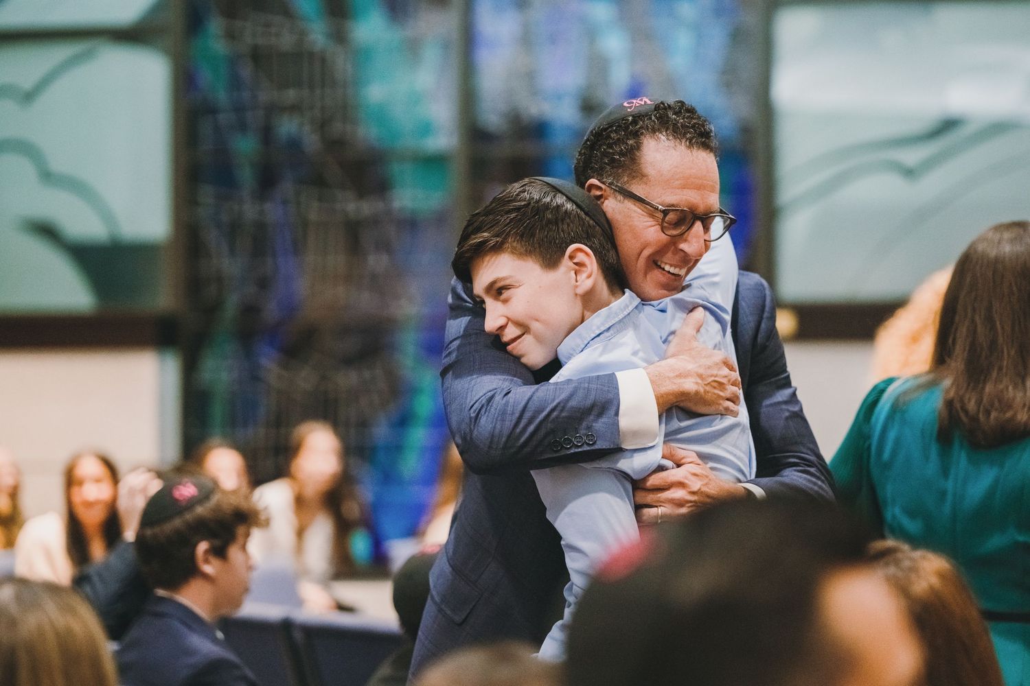 Warm embrace in a Bar Mitzvah in Potomac, MD.