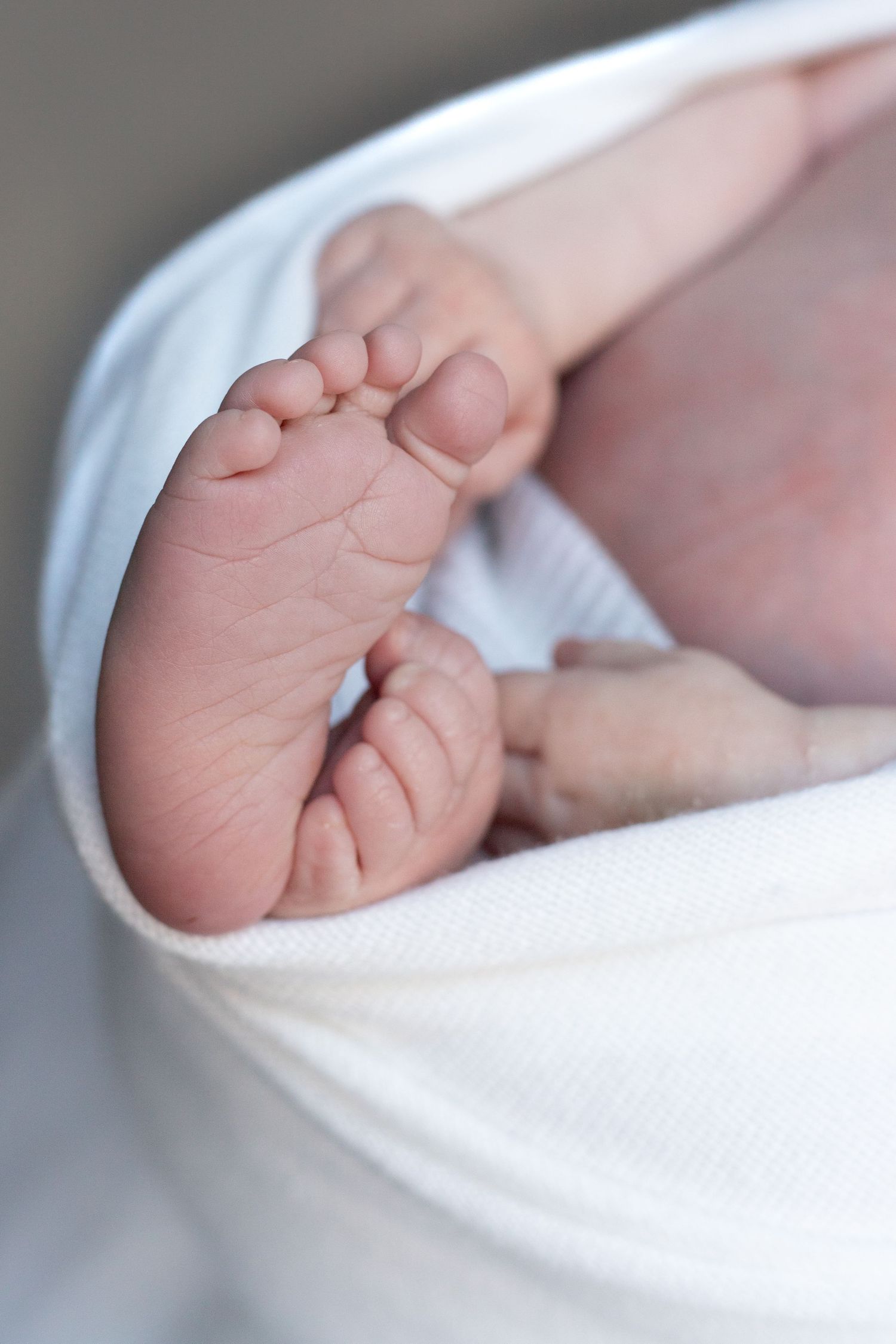 Intimate newborn moments captured at home — specialising in detail-focused baby photography in Hertfordshire and surrounding areas
