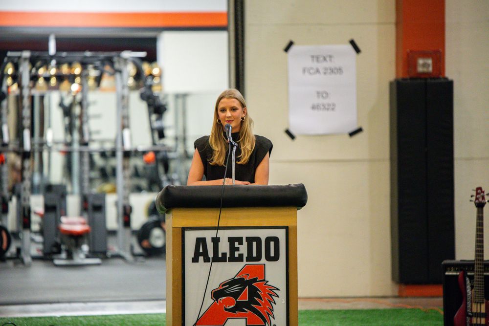 Athletic facility interior with Aledo branding and equipment visible along the walls.