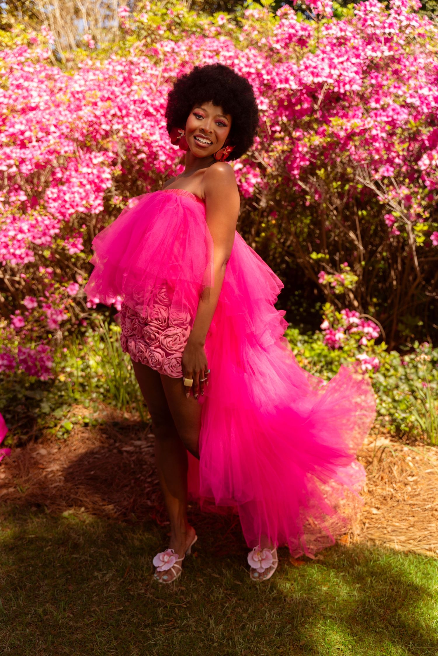 Lanatria with a natural Afro hairstyle wearing a pink tulle dress at Azalea Festival Garden Party Airlie Gardens, Wilmington NC.