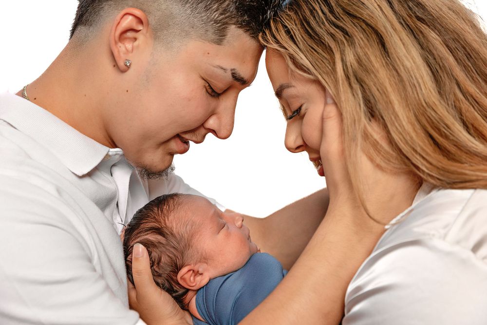 photographer captures proud parents in studio in Fresno,ca