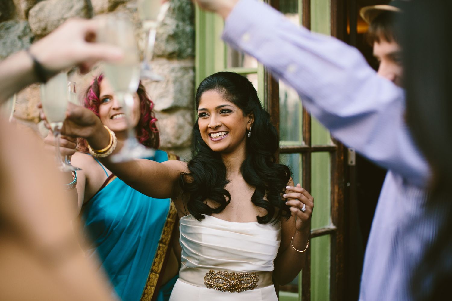 Joyful celebration during a toast at a wedding reception party.