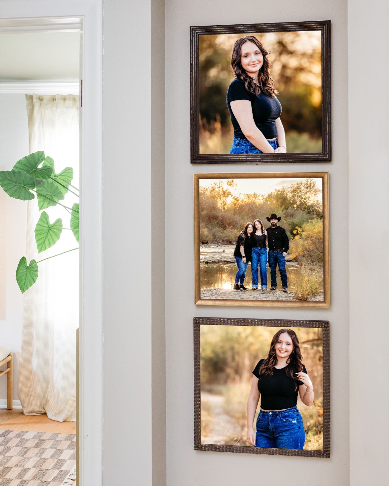 Three framed senior portrait photos displayed on a white wall, featuring a young woman and family at a park in Fort Worth TX.