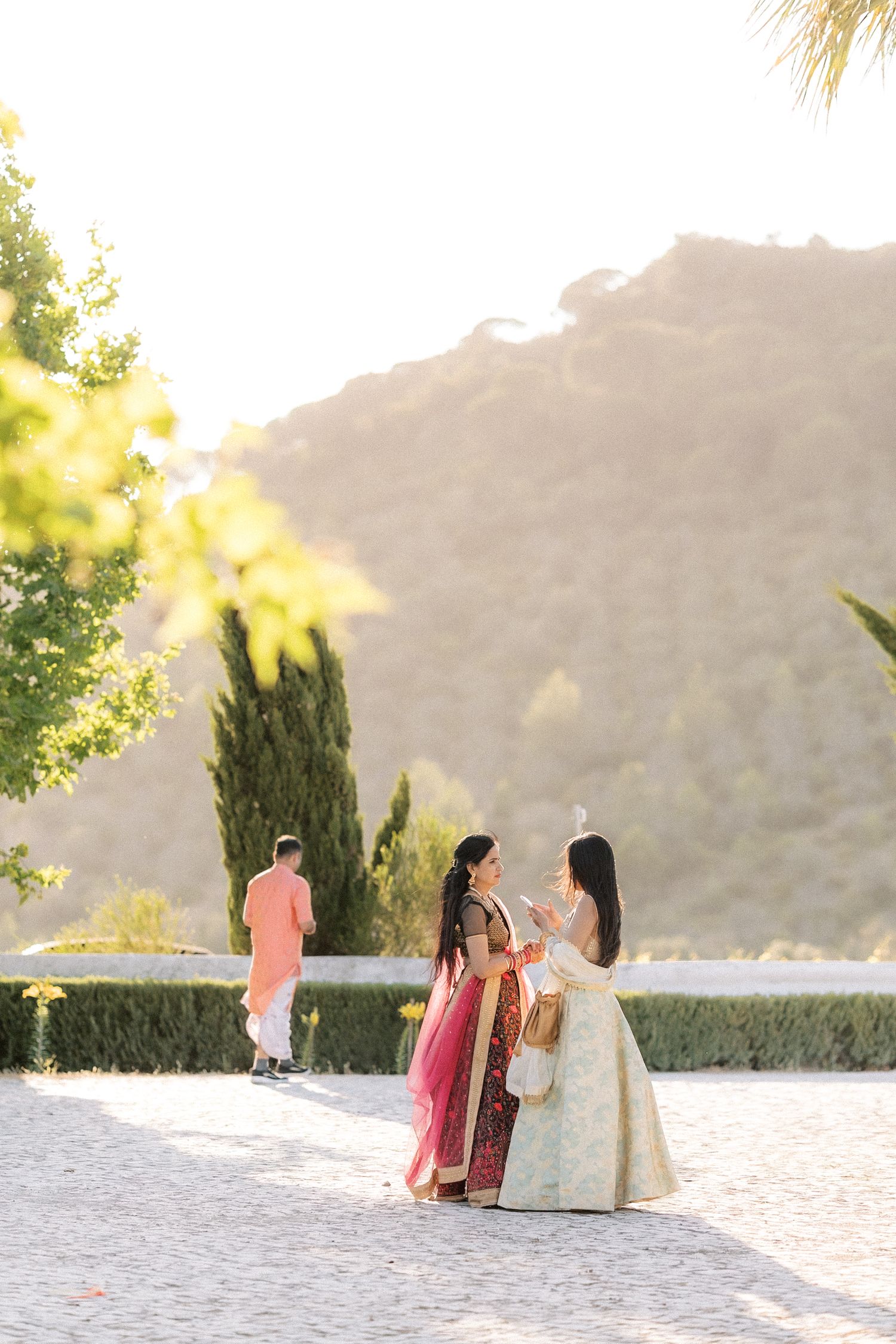 guests enjoying drinks at sunset during Indian wedding in Portugal