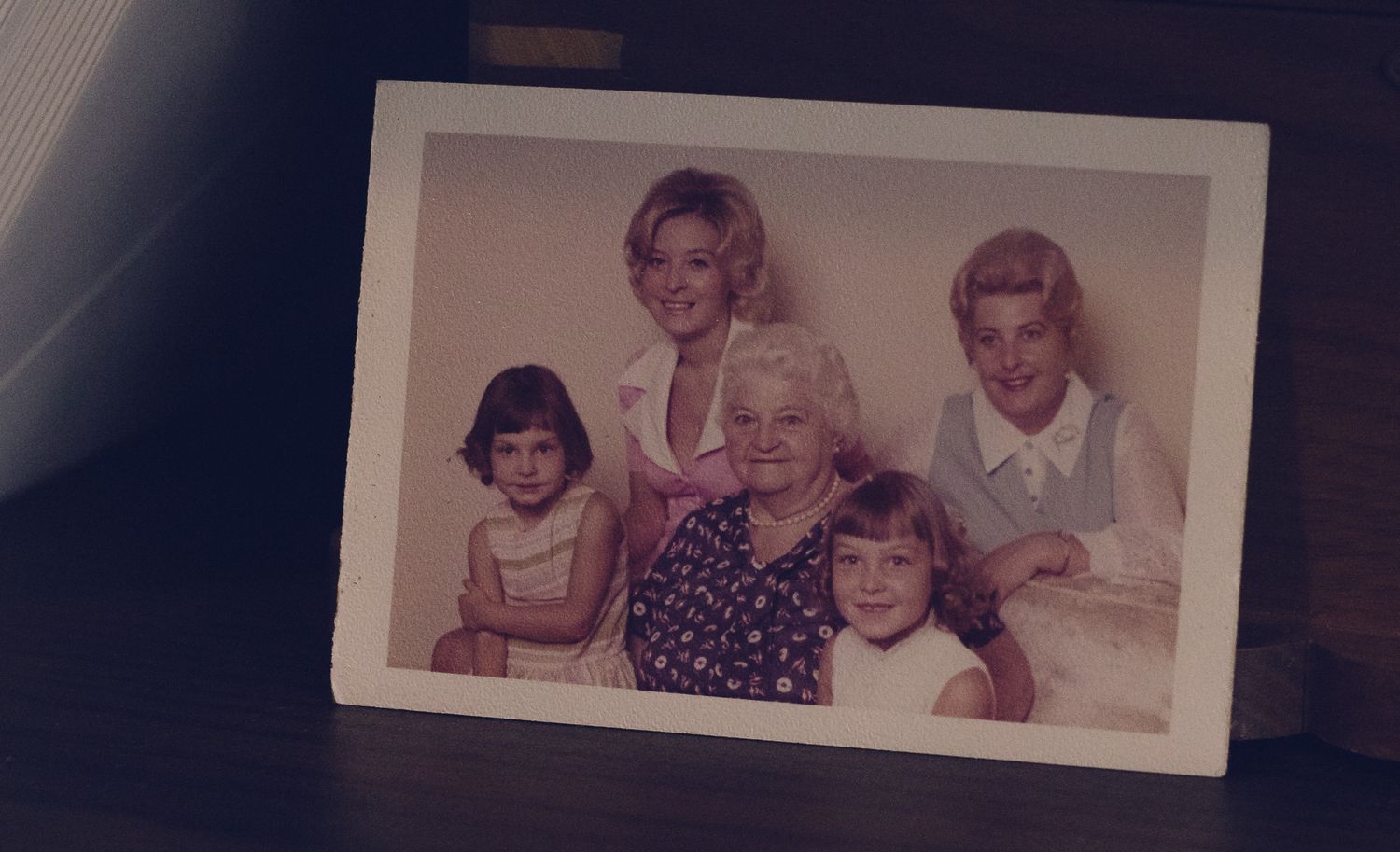 Vintage family photo showing five women and girls posing together, likely from the 1960s or 1970s.