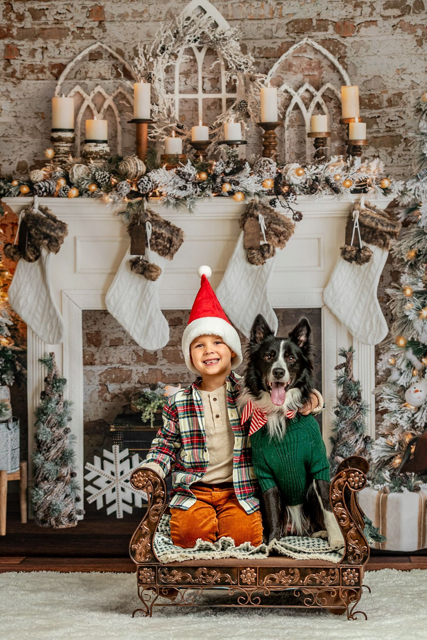 Festive Christmas scene with white stockings and dog by decorated brick fireplace.