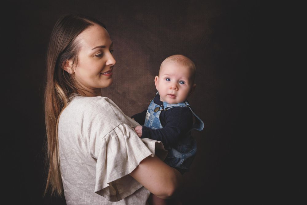 Painterly style portrait of boy and his mum.