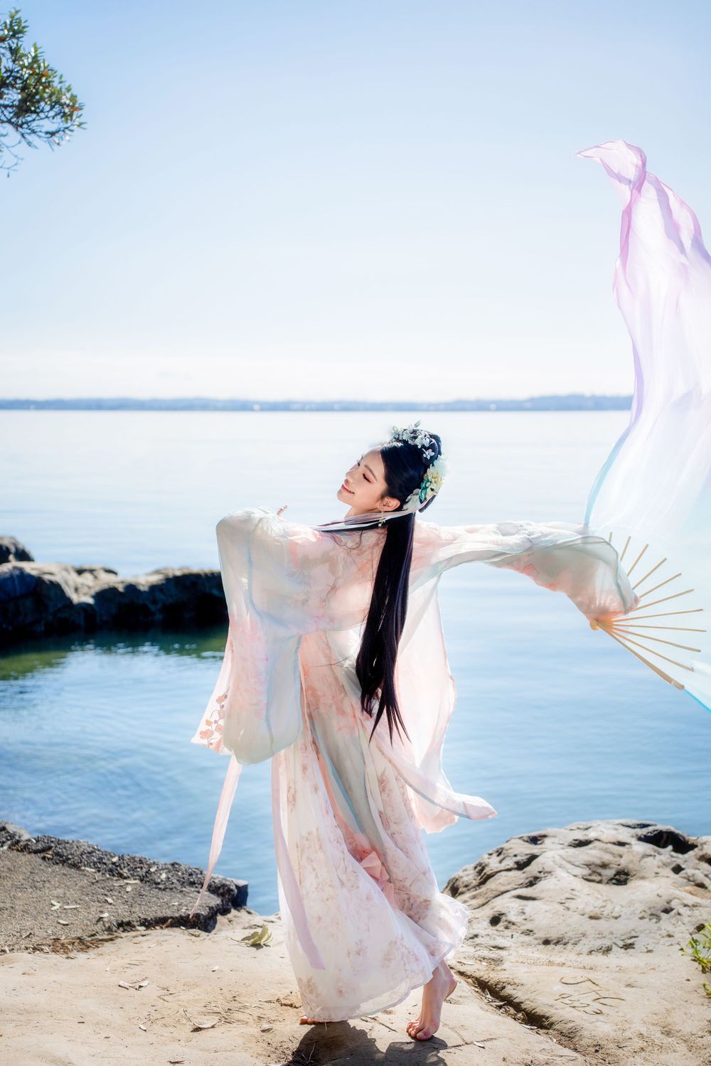 Beautiful seaside Hanfu dance portrait featuring flowing traditional clothing at Point Chevalier, by an Auckland photographer.
