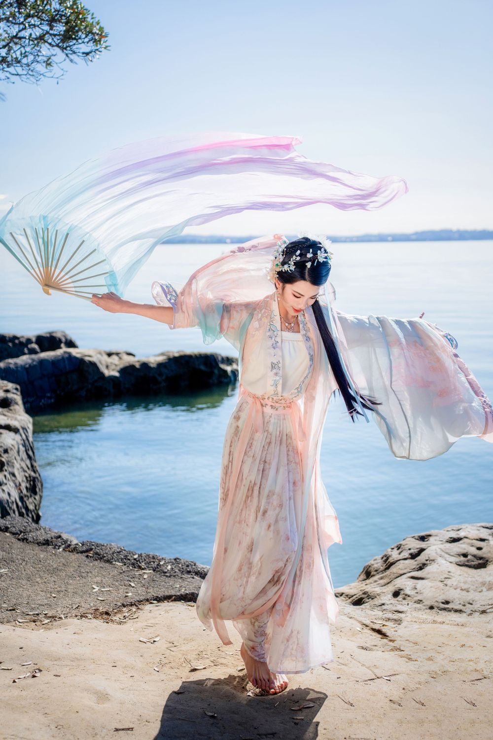 Beautiful seaside Hanfu dance portrait featuring flowing traditional clothing at Point Chevalier, by an Auckland photographer.
