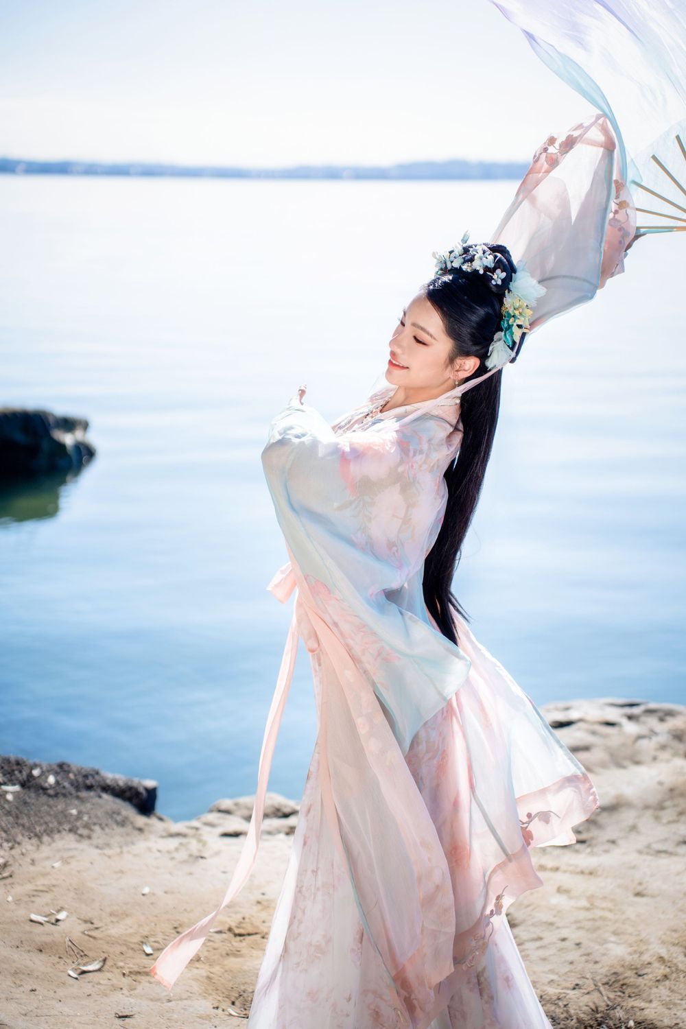Beautiful seaside Hanfu dance portrait featuring flowing traditional clothing at Point Chevalier, by an Auckland photographer.