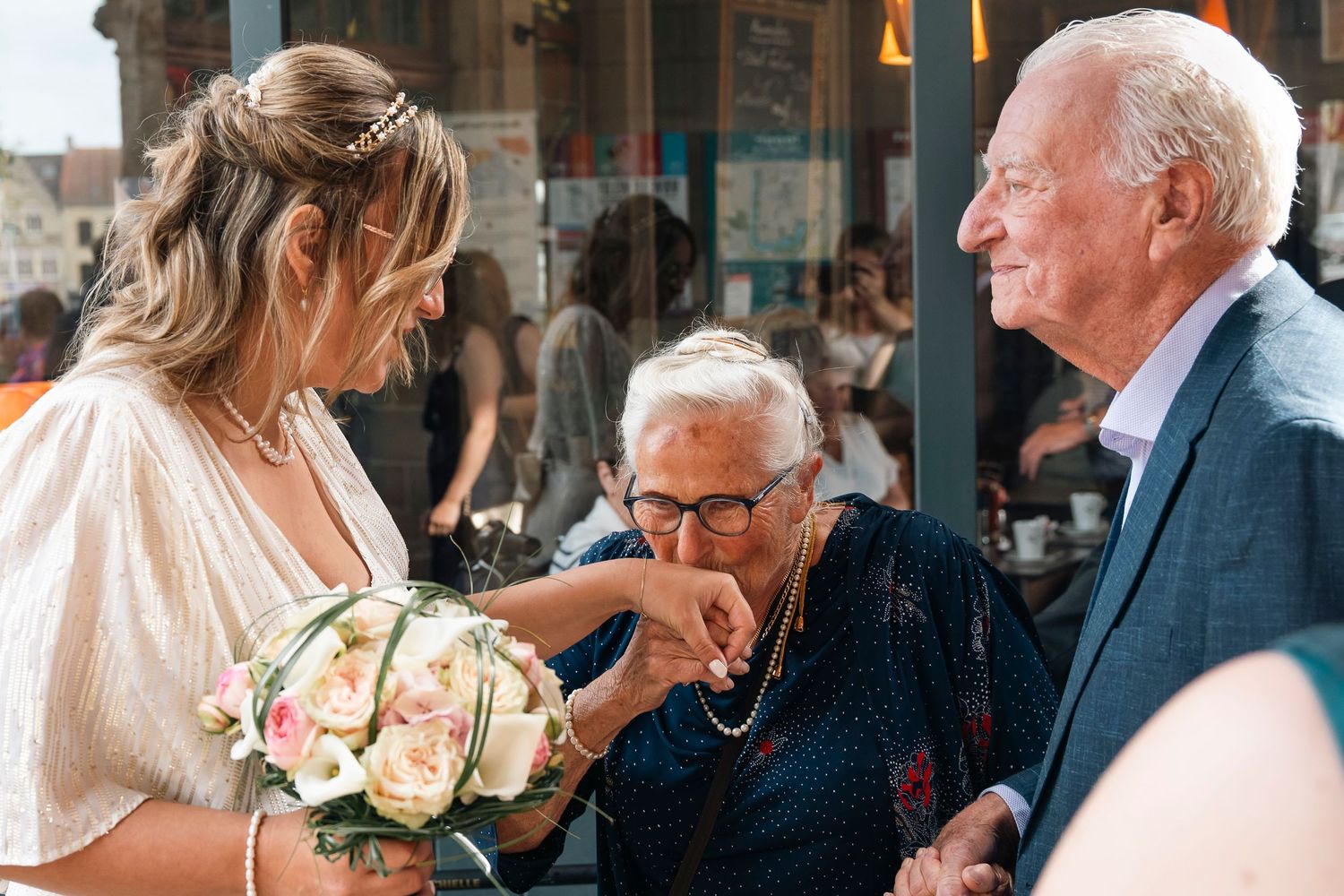 A tender moment shared between wedding guests during outdoor reception celebrations.