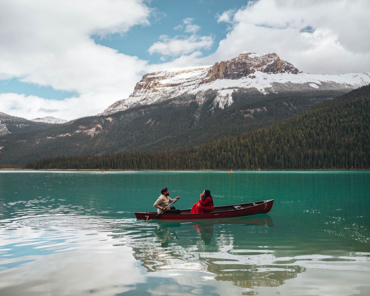 Couple in a kayak on Emerald Lake. Rockies engagement photo.
