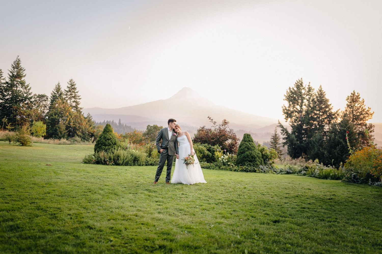 Couple at wedding venue in Hood River, Oregon at Mt Hood Organic Farms at sunset