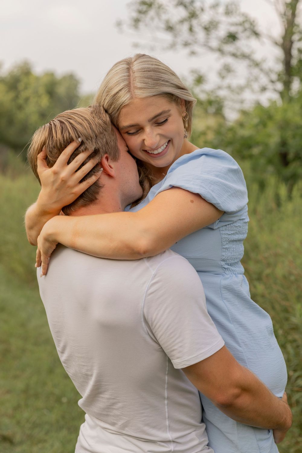 couple hugging each other and smiling