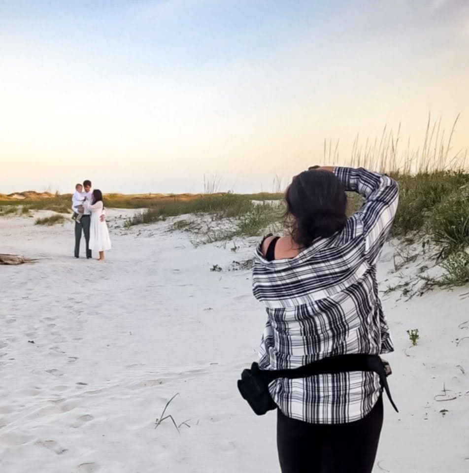 Behind the scenes photo of outdoor portrait session with photographer on stepladder.